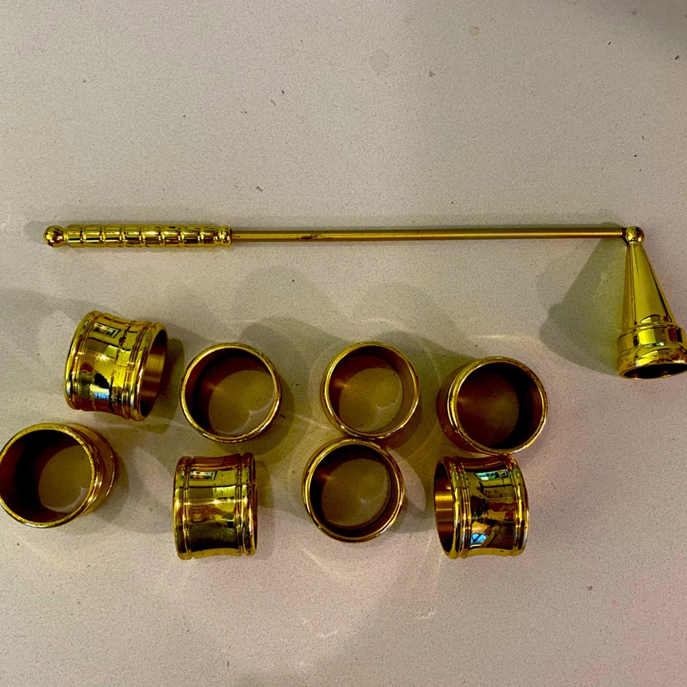 Brass candle snuffer and 8 napkin rings